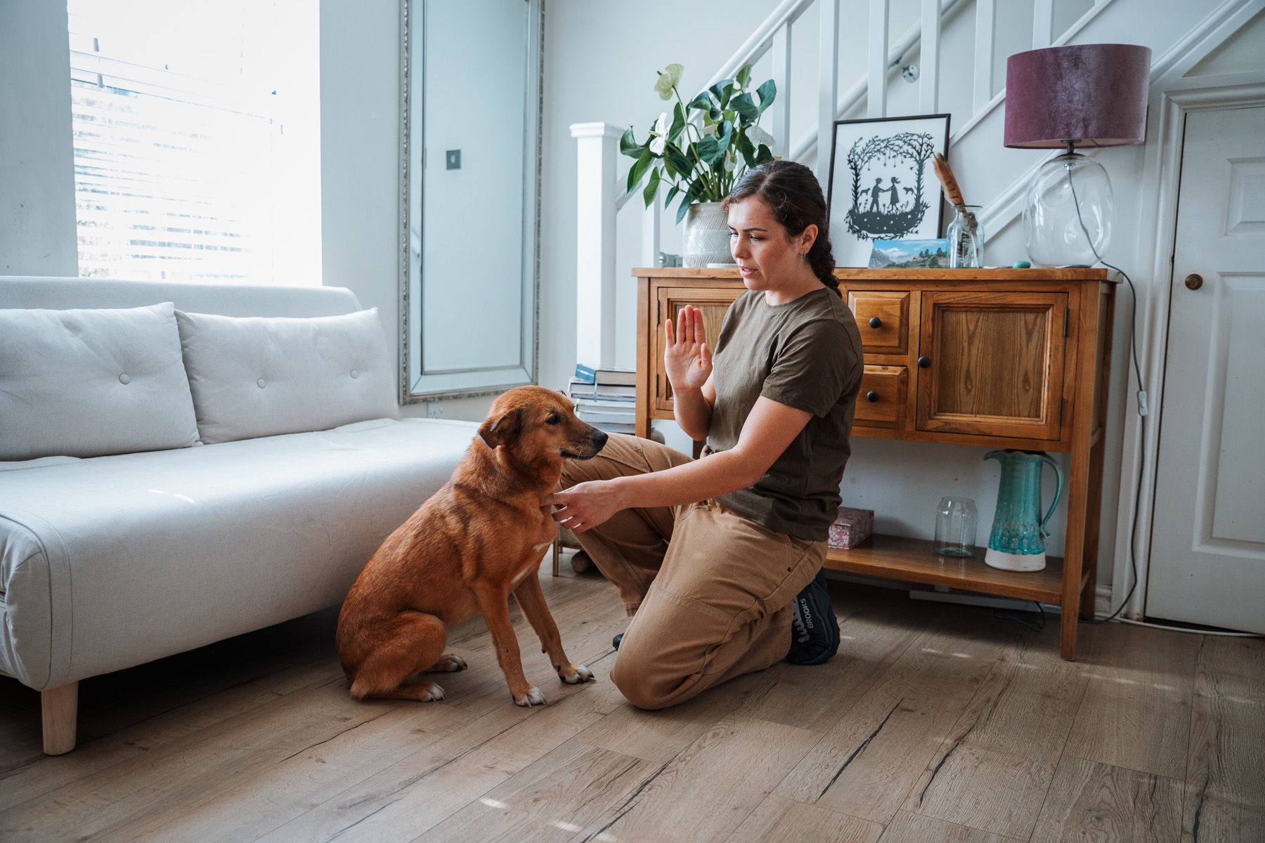 Flurina practising an individual training exercise with a dog at home
