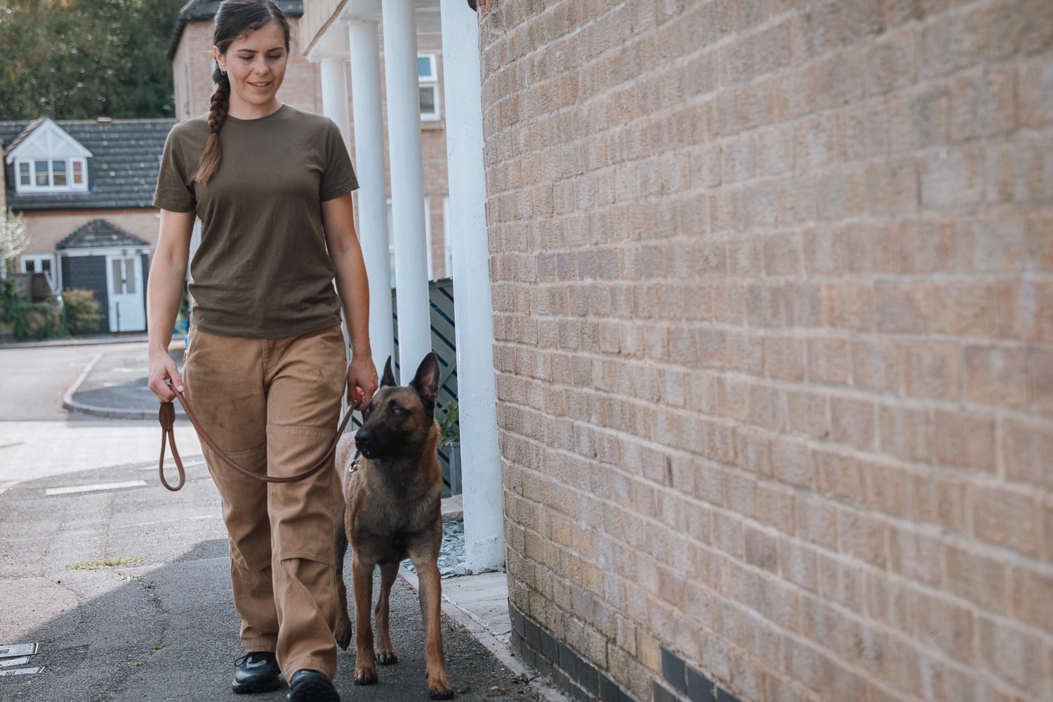 Flurina practising lead walking with a dog on a residential street